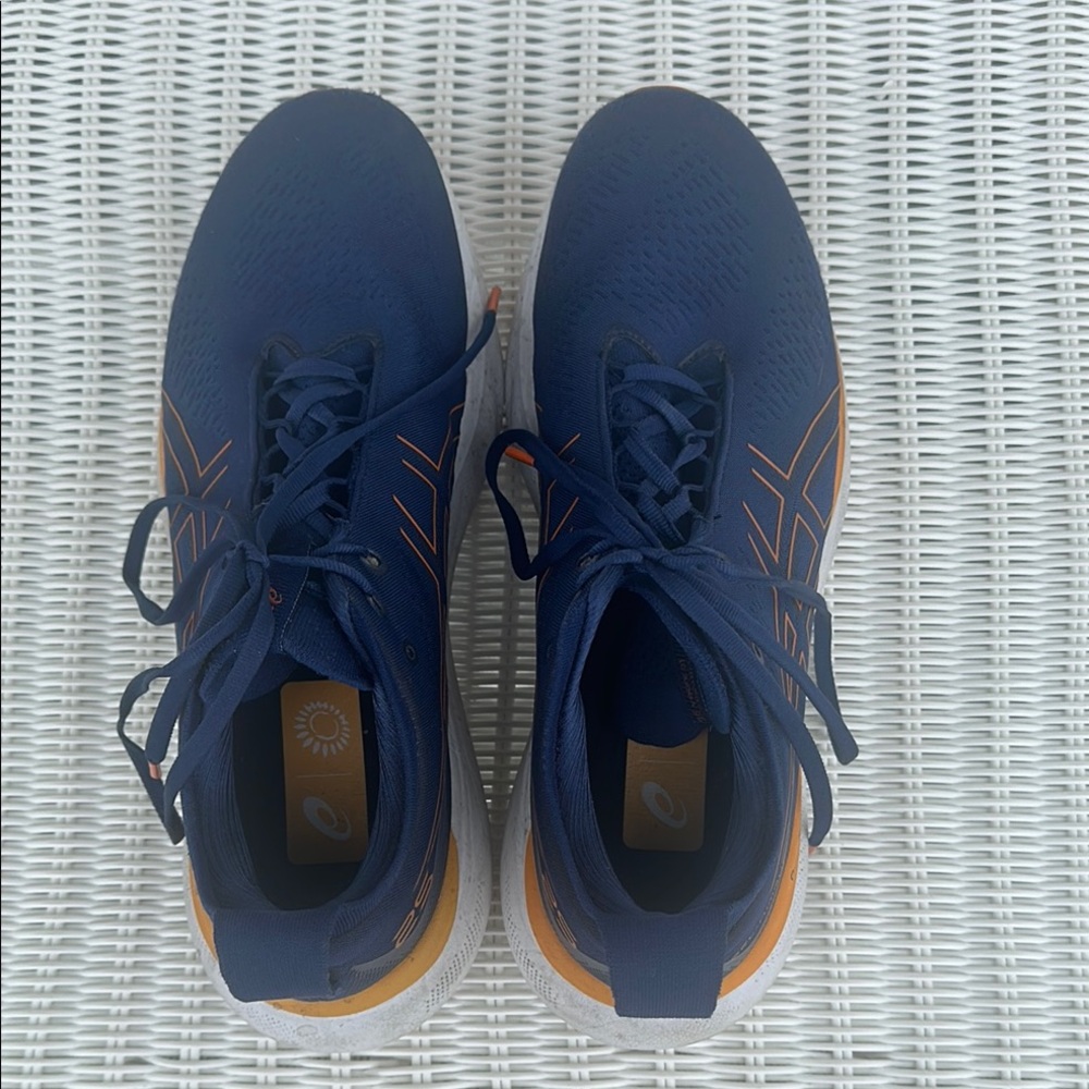 Asics Blue and Orange Athletic Shoes with Sleek Design ASICS Gel-Nimbus 25.